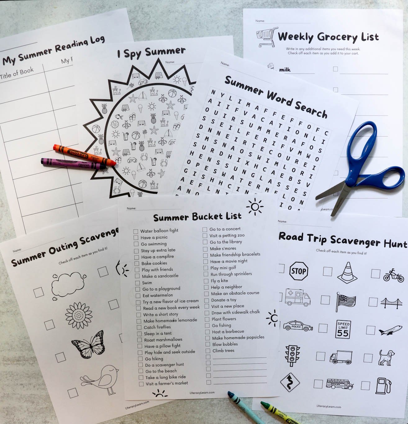 Top down photo of the worksheets surrounded by scissors and crayons.