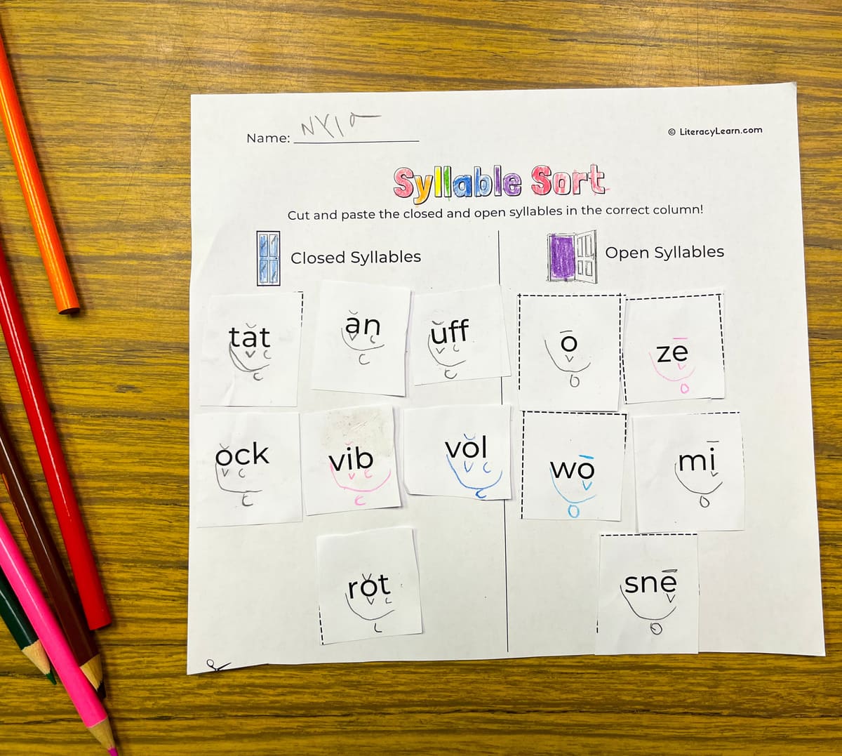 A finished syllable sort worksheet marked up.