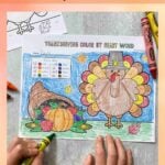 Pinterest graphic with an image of a child coloring in the color by sight word printable.