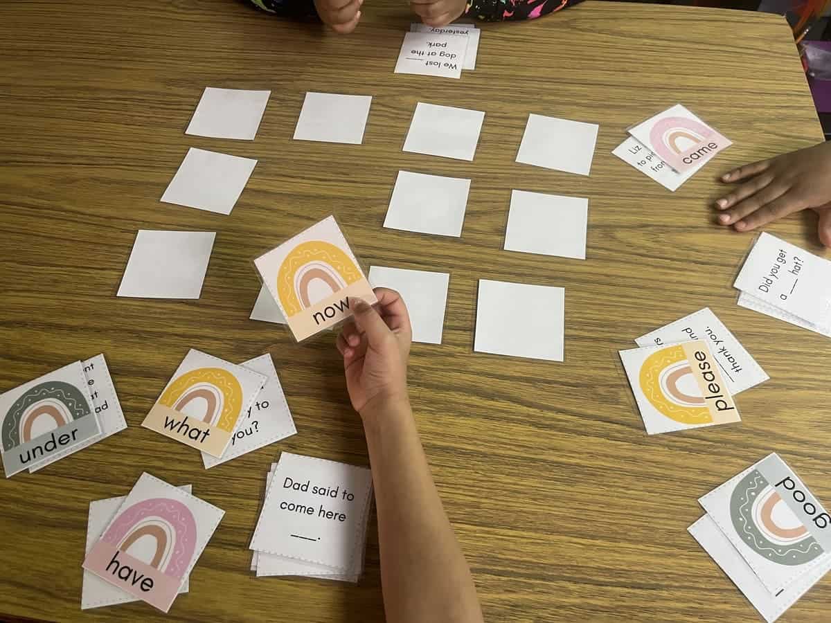 Photo of 3 students playing the Dolch sight word game.