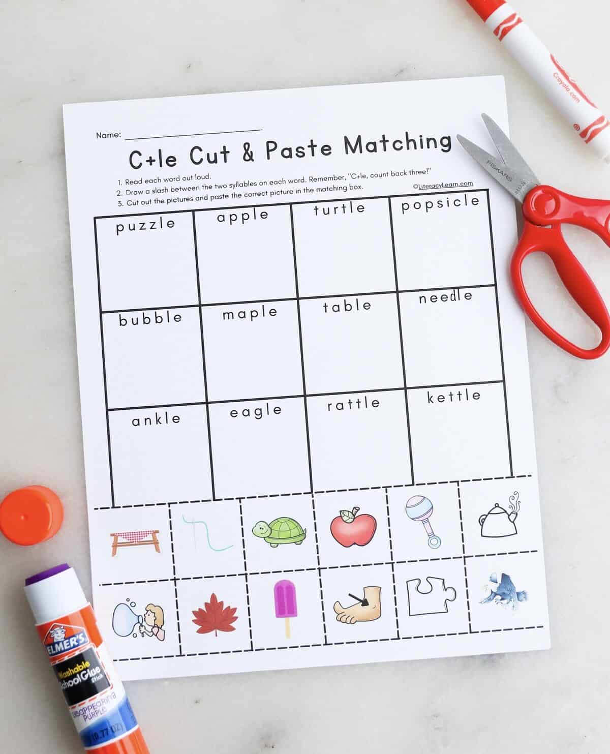 A printed C+le picture match worksheet with a scissor and glue stick 