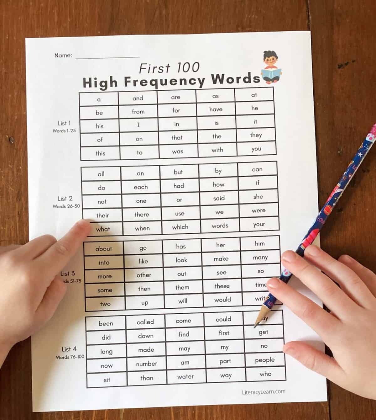 A child reading a list of Fry's 100 first High Frequency Words.