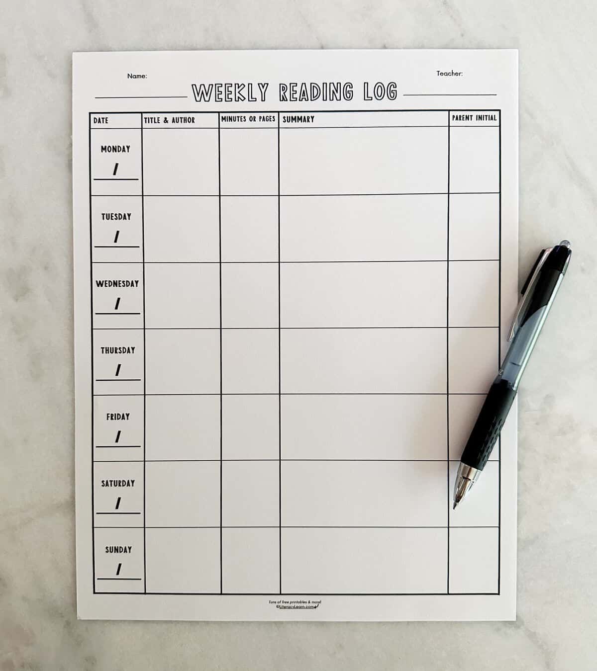 A printed weekly reading log with a pen.