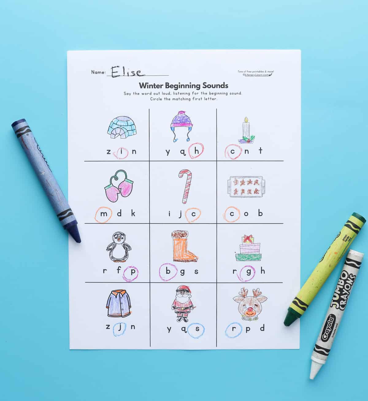 Winter-themed beginning sounds worksheet on a blue background.