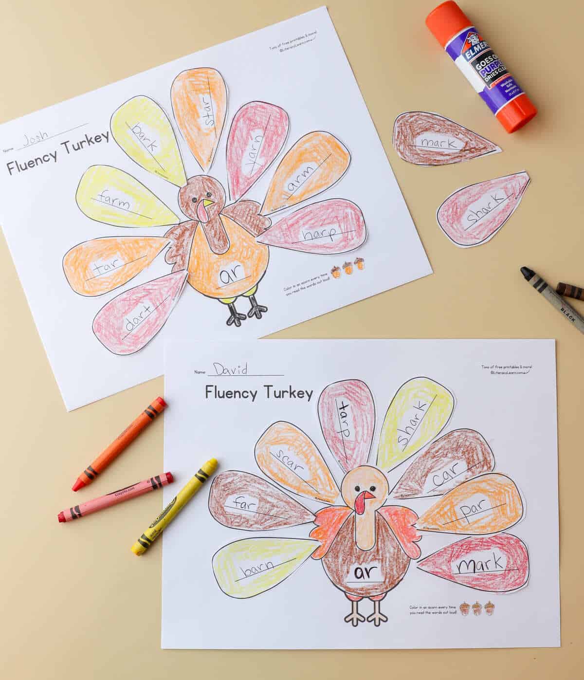 Two printed and completed fluency turkey worksheets with crayons.