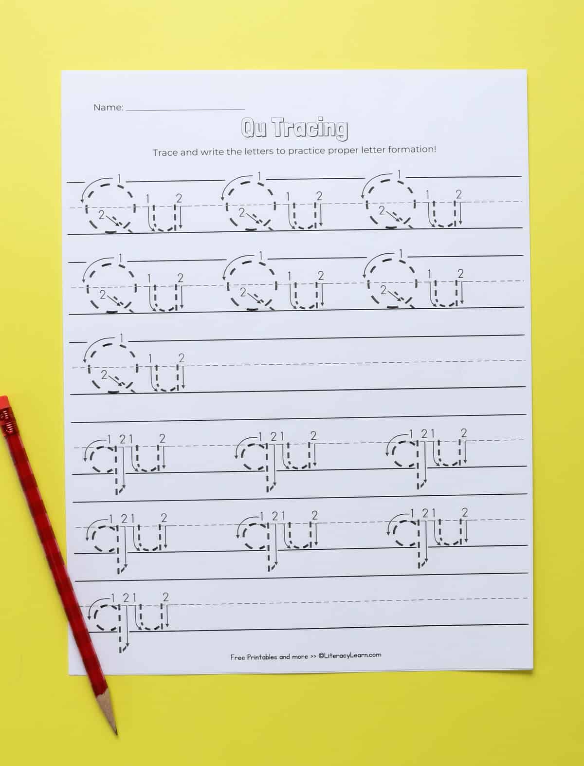 A printed letter q tracing and writing worksheet.