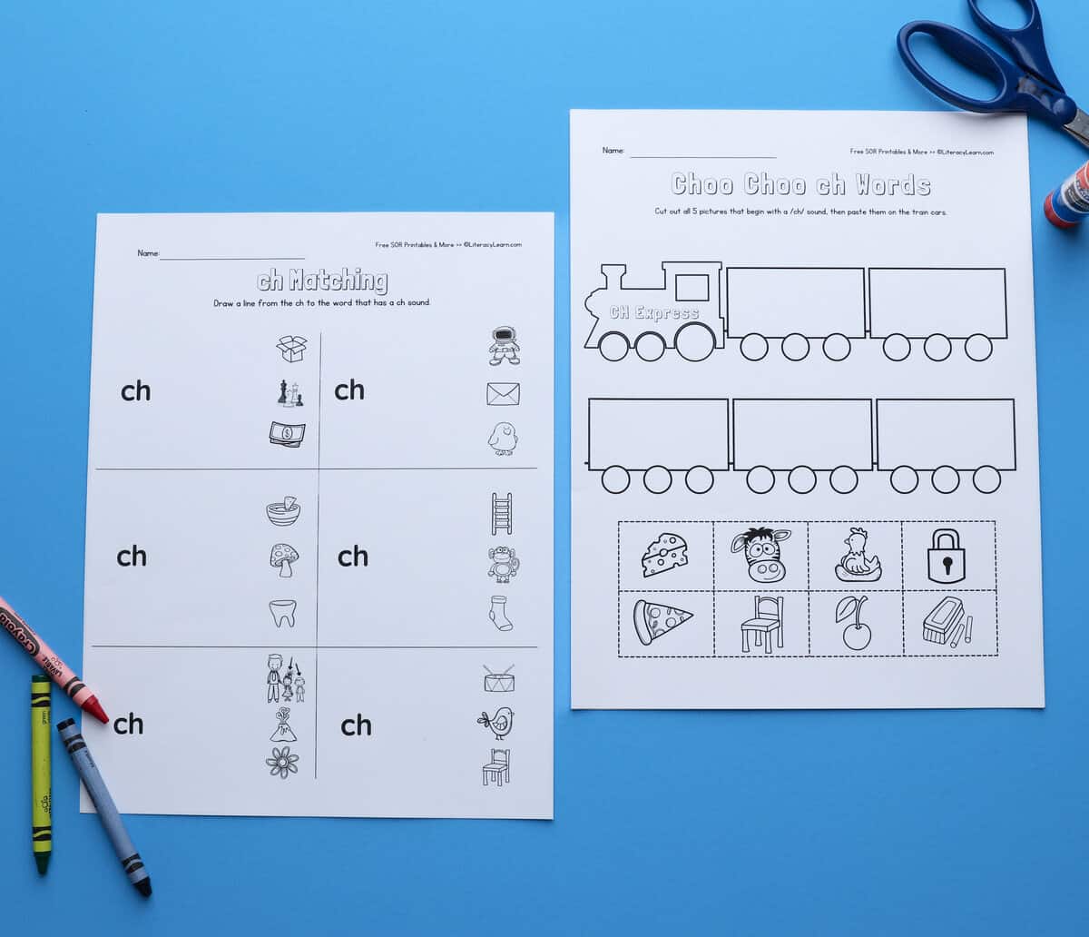 The printed CH matching and Cut and Paste train worksheet with crayons and scissor. 