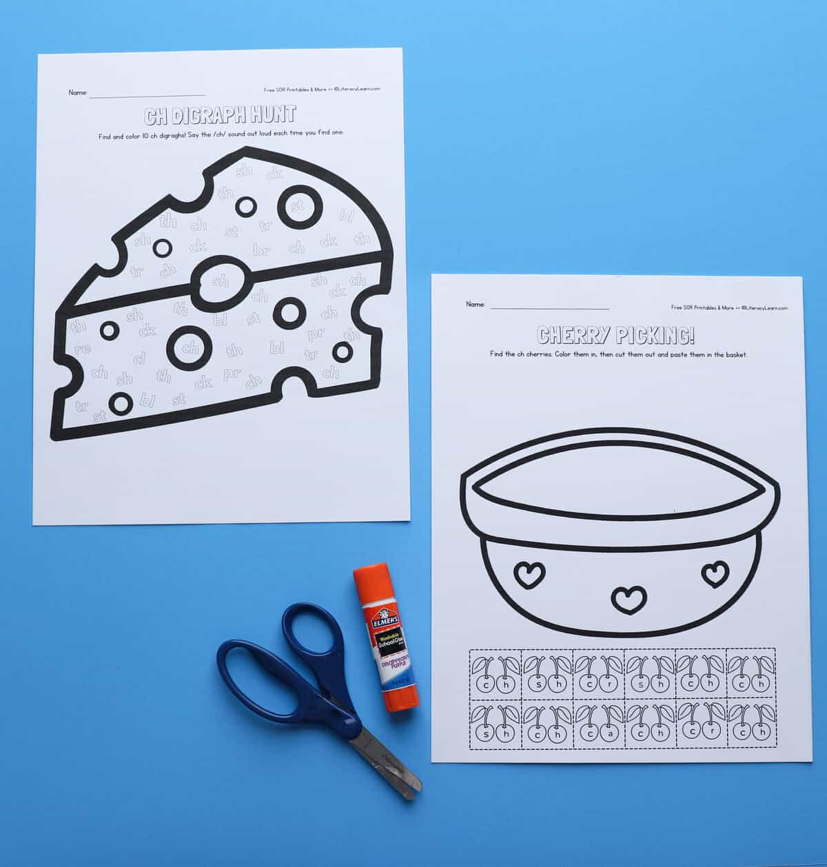 The printed Cherry picking worksheet and CH digraph hunt worksheet with scissors and glue stick. 