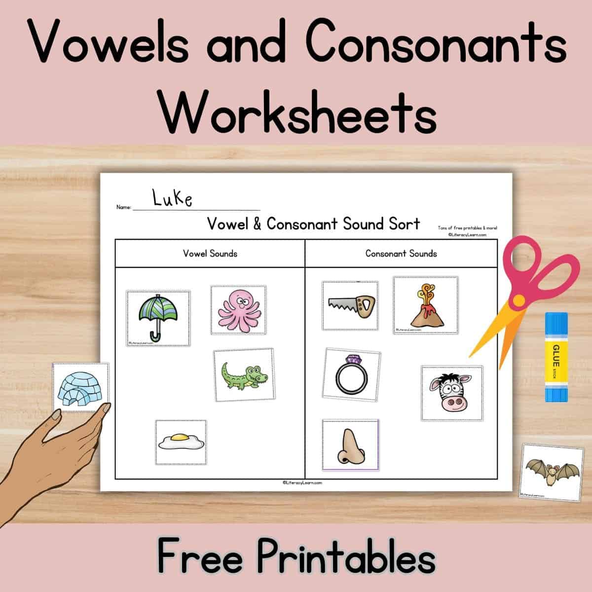 Vowels and consonants sounds worksheets on a table with scissors and glue.