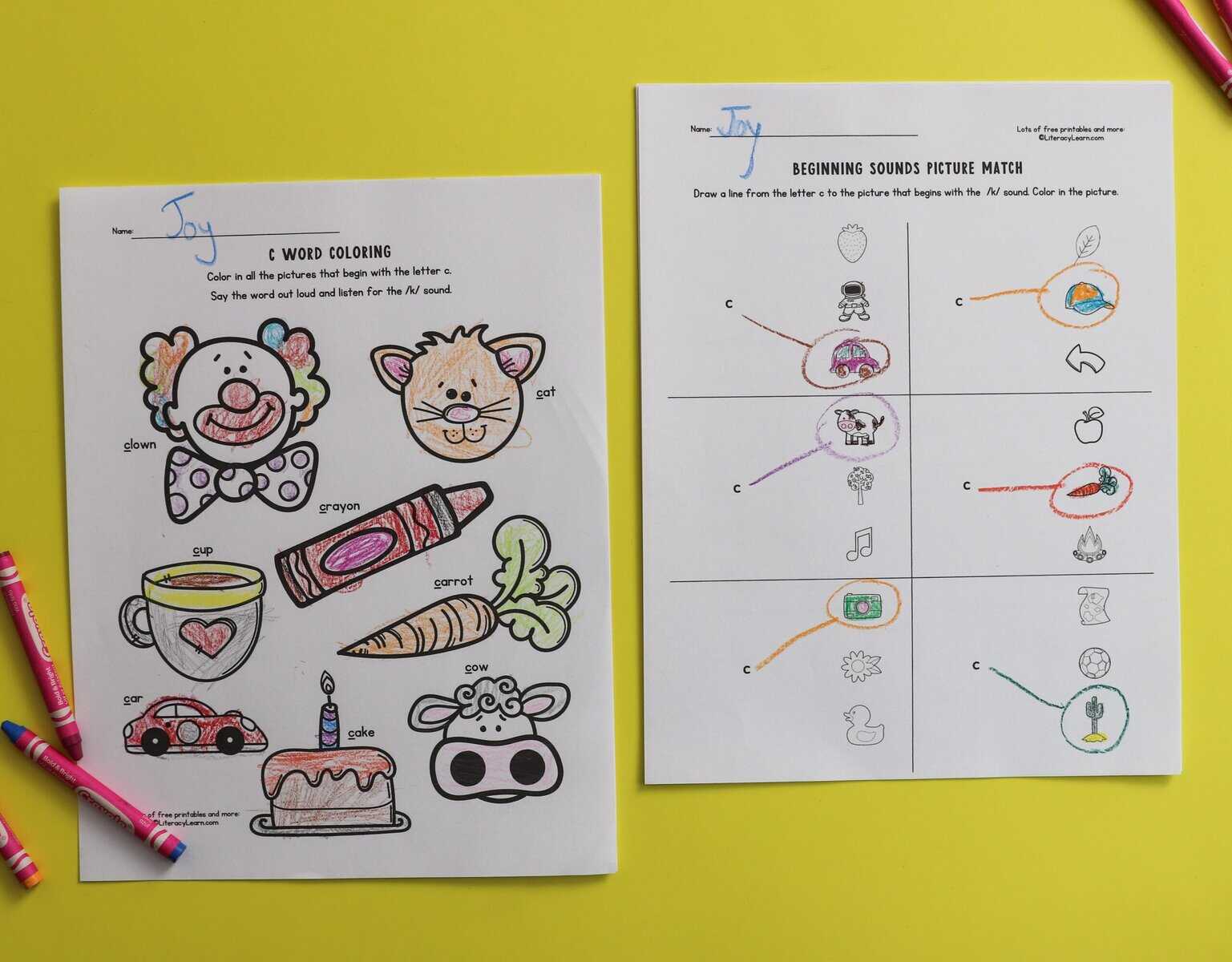 Two printed and completed letter c sounds worksheets.