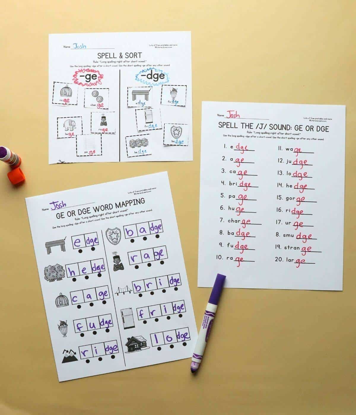 Three printed and completed  ge/dge spelling worksheets with a marker.