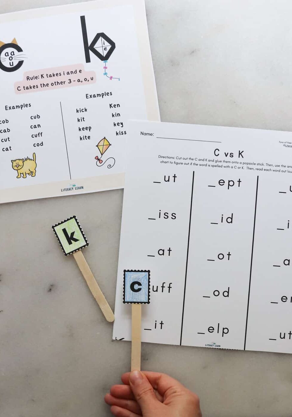 K or C worksheets on a white board.